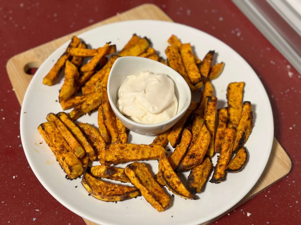 Fried sweet potatoes served on a plate with mayonnaise
