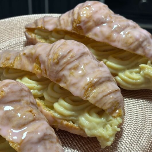 Croissants Filled with Pastry Cream Covered With Pink Icing