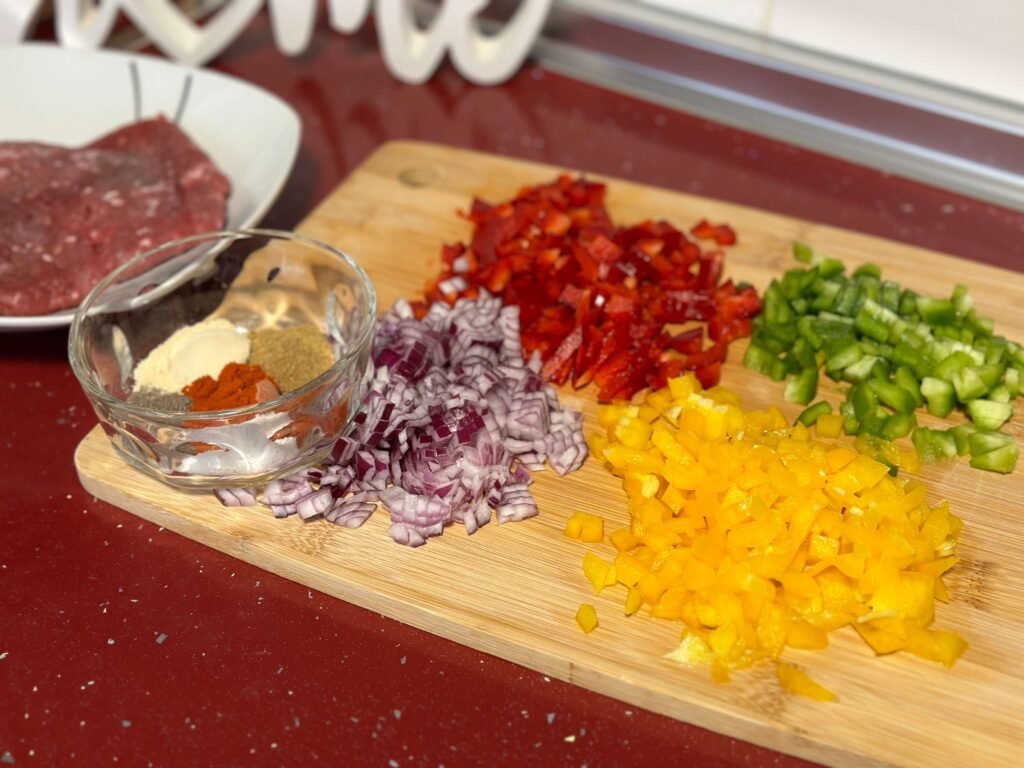 tricolor peppers, chopped red onion, spices and minced meat