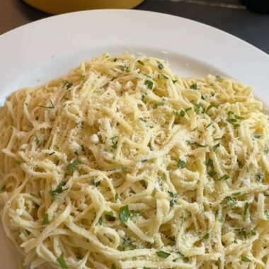 Pasta dish with oil and garlic and Parmigiano Reggiano