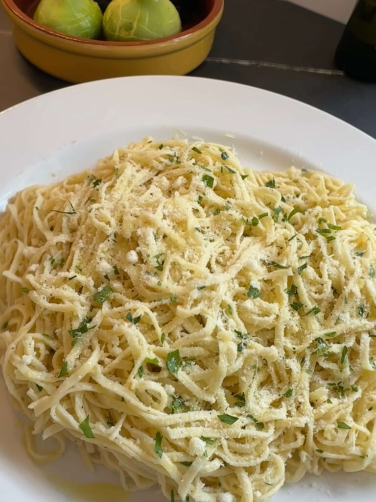 Pasta dish with oil and garlic and Parmigiano Reggiano